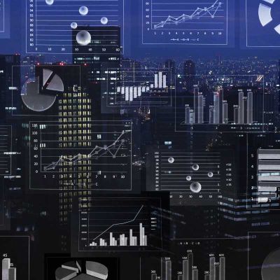 City skyline with an overlay of graphs and reports
