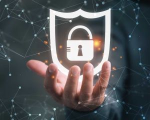 Hand holding cybersecurity virtual lock